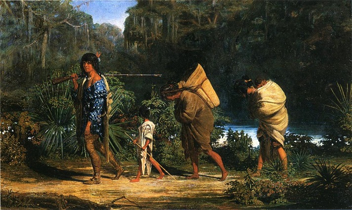 Native Americans walking along trail
