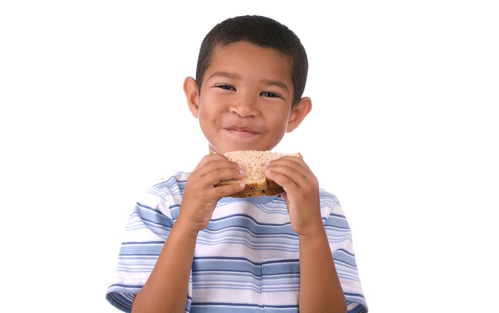 boy eating a sandwich