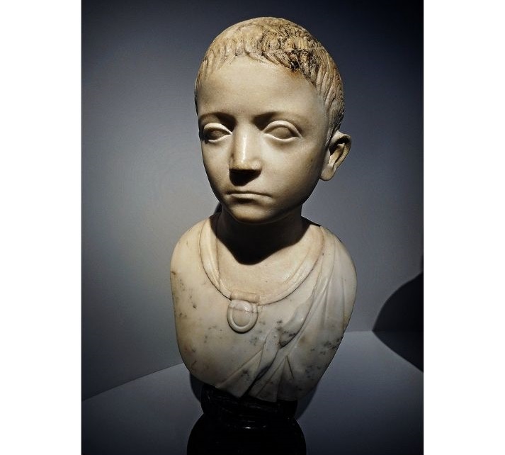 bust of a child with a bulla