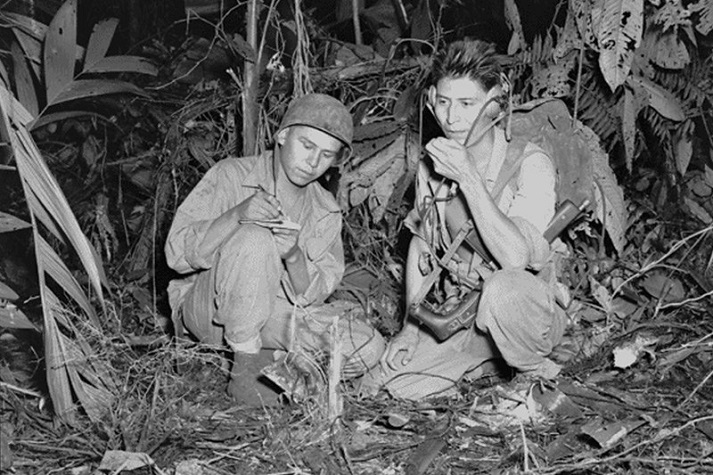 Navajo Code Talkers Marine Corps Cpl. Henry Bake, Jr. and Pfc. George H. Kirk used a portable radio near enemy lines to communicate with fellow Marines in December 1943.
