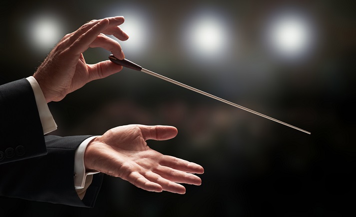 conductor conducting an orchestra