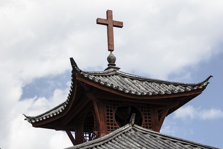 traditional Chinese roof with cross