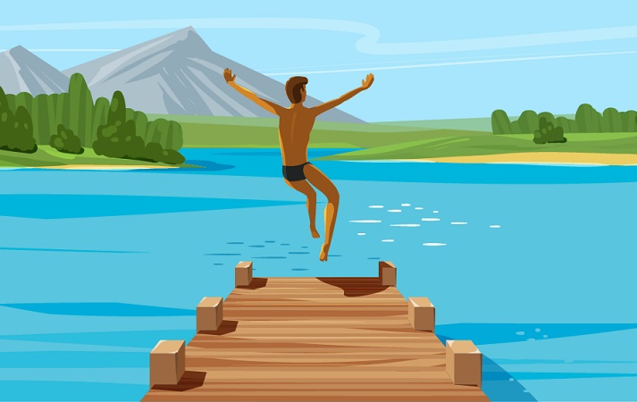 boy jumping into a lake