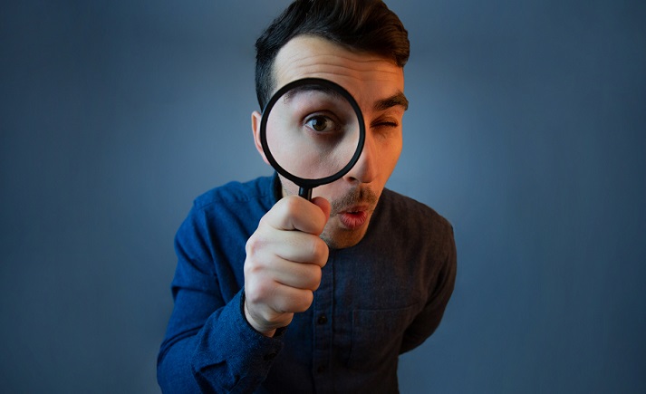 man with a magnifying glass