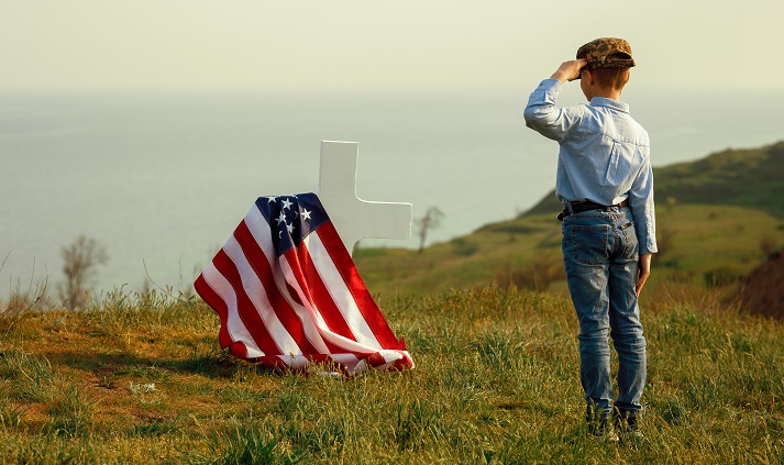 young man honors a fallen soldier
