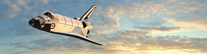 space shuttle flying in the sky at sunset