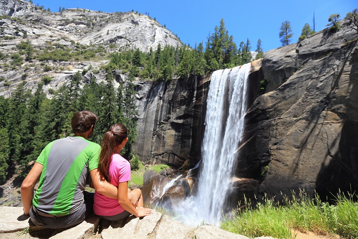 hikers at Yosemite waterfall
